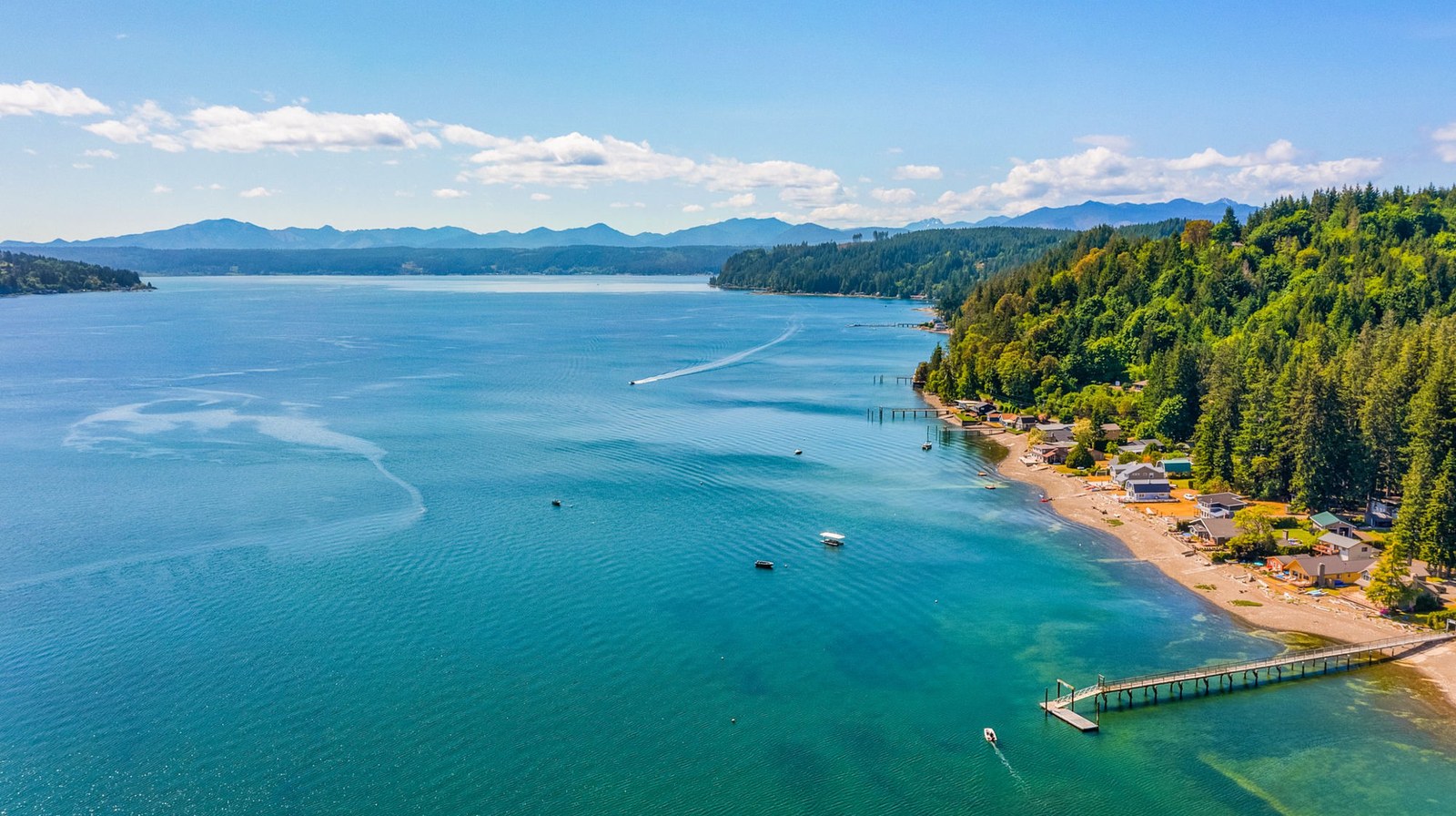 Aerial view of Hood Canal at the Great Bend near Union, Washington, with Olympic Mountains in the background